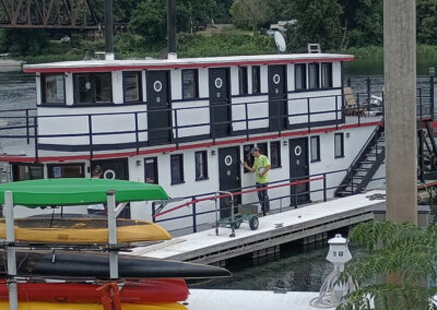 repainting a houseboat exterior
